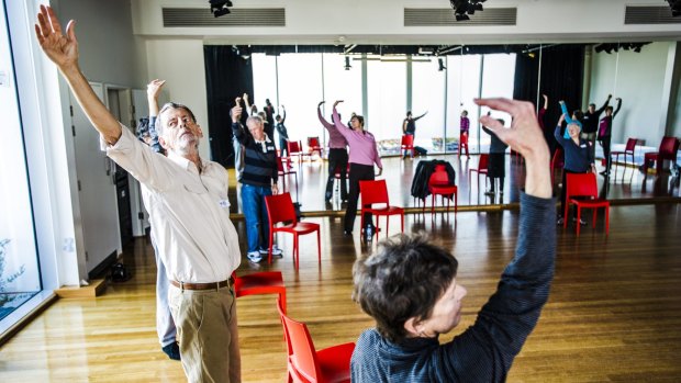 Chris Creswell, left, joins in the Dance for People with Parkinson's at the Belconnen Arts Centre.