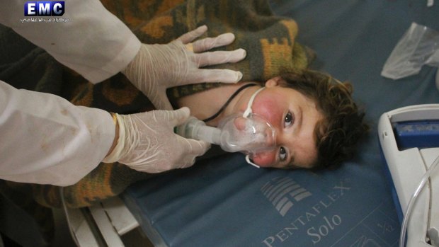 A Syrian doctor treats a child following the chemical attack in Khan Sheikhoun, Syria.