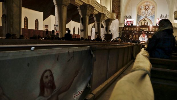 Egyptian Coptic Christians prepare to pray during the Easter Eve service at St Mark's Cathedral in Cairo after an attack on the church on Palm Sunday.