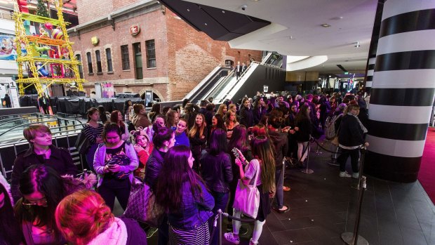 Customers queue at the opening of the new Sephora store at Melbourne Central. 
