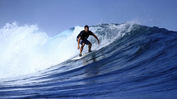 Mark Baguley cuts a mean figure while surfing.