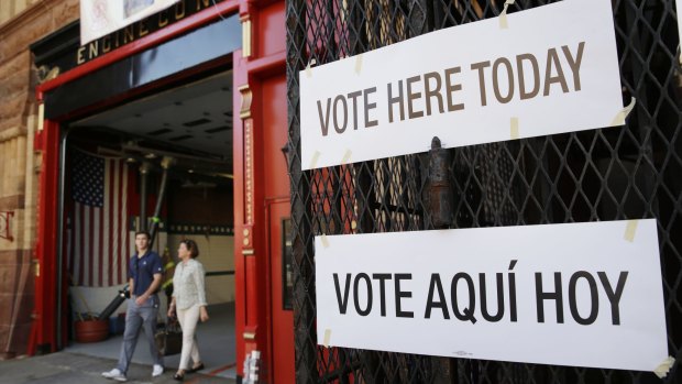 Voters leaves a polling site in a fire station in Hoboken, New Jersey on Tuesday.