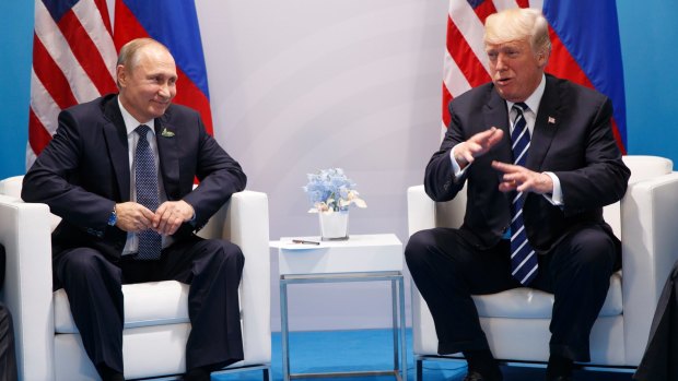 US President Donald Trump speaks during a meeting with Russian President Vladimir Putin at the G20 Summit in Hamburg on Friday.