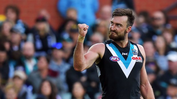 Charlie Dixon of the Power reacts after kicking a goal during the round two match against Fremantle Dockers at Adelaide Oval on Sunday. 