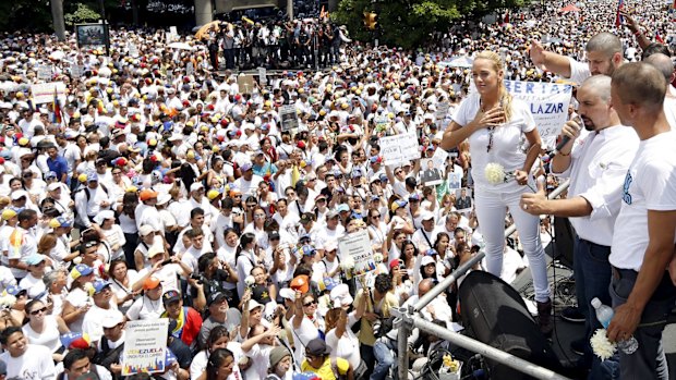 Thousands attend the rally demanding freedom for political prisoners and a date for parliamentary elections.