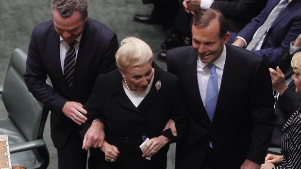 Bronwyn Bishop is dragged to the Speaker's chair by Prime Minister Tony Abbott and Christopher Pyne after the 2013 election. 