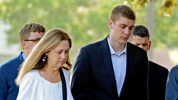 Brock Turner, right, attends court. 