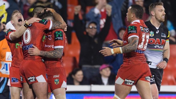 Vital win: The Dragons celebrate at full-time at Pepper Stadium.