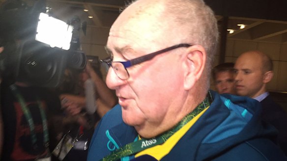 AOC head of security Greg Nance arrives at the police station where Australian athletes were being held.
