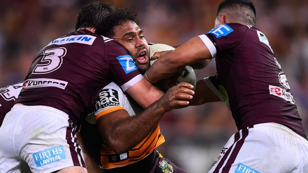 Success: Sam Thaiday of the Broncos is tackled by Jamie Lyon and Matthew Wright of the Sea Eagles during the double header at Suncorp Stadium on Saturday. 