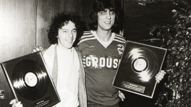Jon English, right, and Mario Millo receive their gold records for the song <i>Six Ribbons</i>.