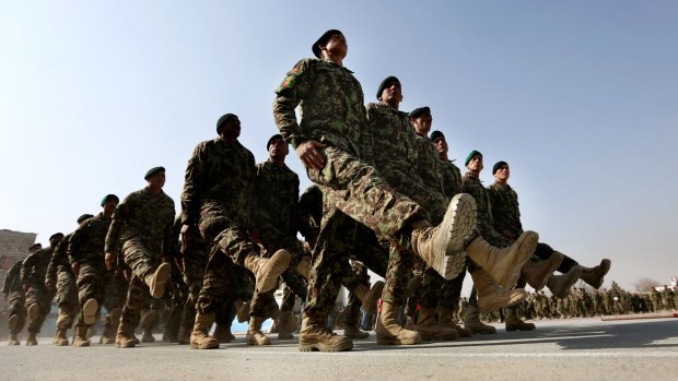 New members of the Afghan National Army march during their graduation ceremony at the Afghan Military Academy in Kabul on Sunday.