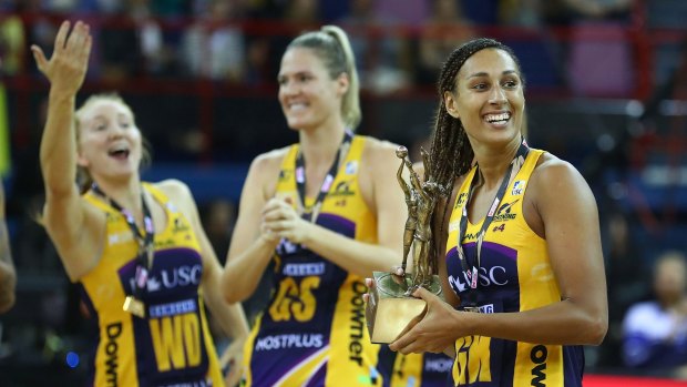 Winning combination: Lightning captain Geva Mentor holds the Super Netball trophy