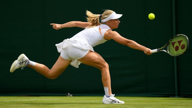 Australian no. 1 Daria Gavrilova stretches for a backhand against Petra Martic of Croatia in the Wimbledon first round on Tuesday.