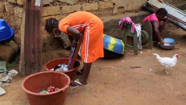 A woman washes clothes in the village of Tanah, Guinea, earlier this month. After killing more than 11,000 people, West Africa's Ebola outbreak is down to a handful of cases.