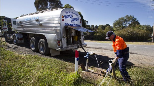 Dave Young fills his 18,000 litre tanker with water near the township of Winchelsea.