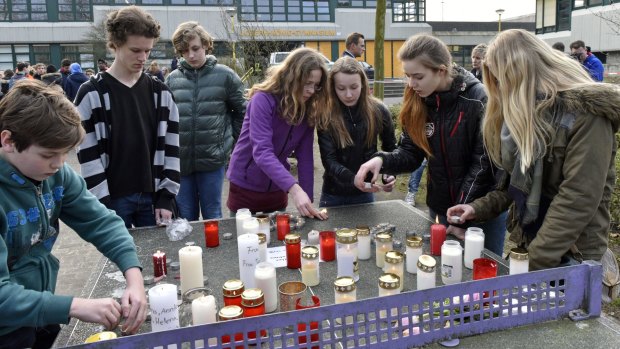 Students light candles at the Joseph-Koenig Gymnasium in Haltern, Germany. Sixteen school children and two teachers from Haltern are among the victims. 