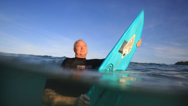 Shark Shield inventor Lindsay Lyon with the electrical shark deterrent device attached to his surfboard.