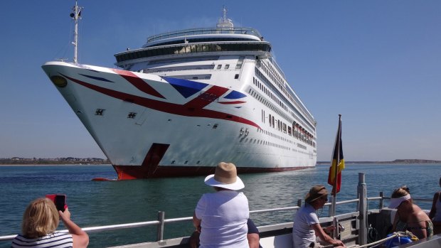 Mudeford Ferry passengers get a close look at P&O's Britannia. 