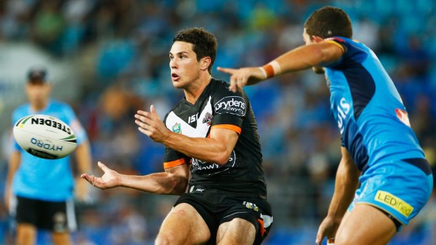Super form: Mitchell Moses takes on the Titans last weekend.