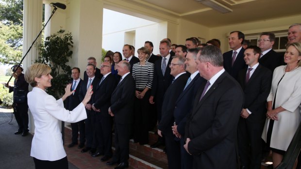 'Everybody sees the boom mic...': Foreign Affairs Julie Bishop organises the ministry photo after the swearing in ceremony on Monday.