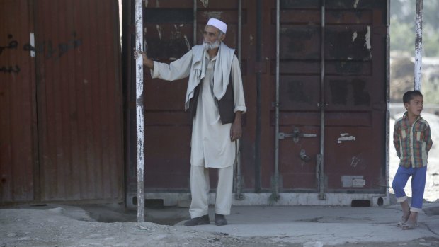 An Afghan elder looks on at the site of the suicide attack in Kabul on Monday.