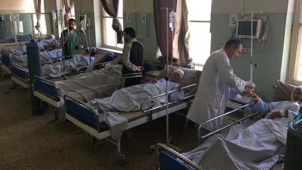Nepalese security guard victims receive treatment at a hospital following a suicide attack in Kabul.