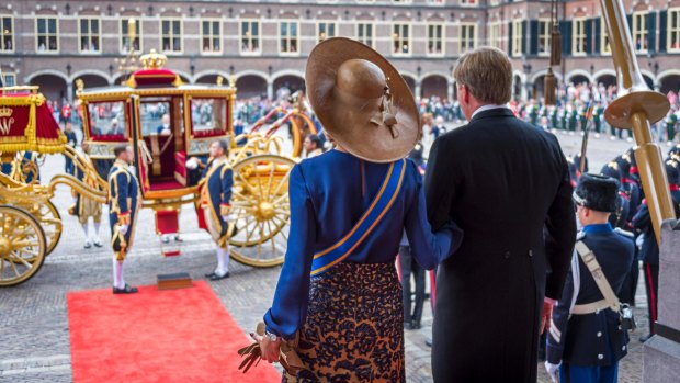 Dutch King Willem-Alexander and Queen Maxima leave the Knight's Hall after the King delivered a speech outlining the government's budget in The Hague on Tuesday.
