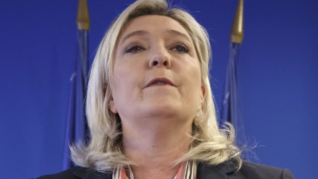 Far-right leader Marine Le Pen speaks during her New Year address at the party's headquarters in Nanterre, west of Paris. She expelled her father from the party in August.
