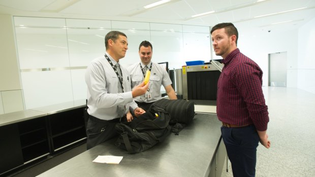 Biosecurity officers Osorio and Chris at the luggage check point. 