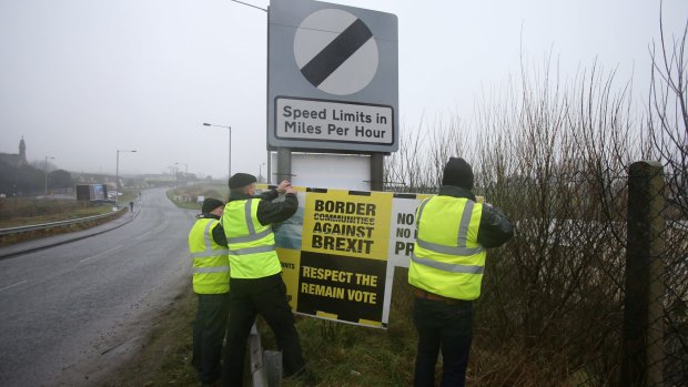 Anti-Brexit campaigners put up signs in Ravensdale, Co Louth on the main road between Northern Ireland and the Republic of Ireland to highlight concerns about the impact on trade.
