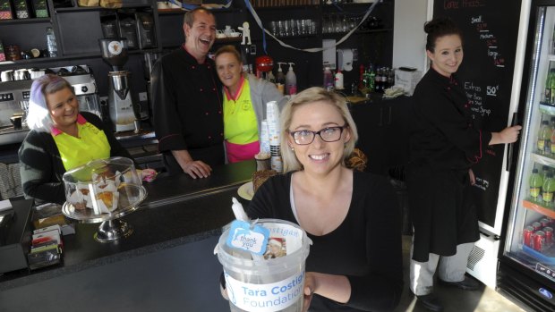 Brooke Morris, front, in her family cafe, Little
Billy's Cafe at Weston Creek, which has raised $7000 for the
Tara Costigan Foundation. Other cafe staff, from left, are Rebecca Morris, Bill Lyras,
Karen Morris and Katelyn Cross-Hicks.