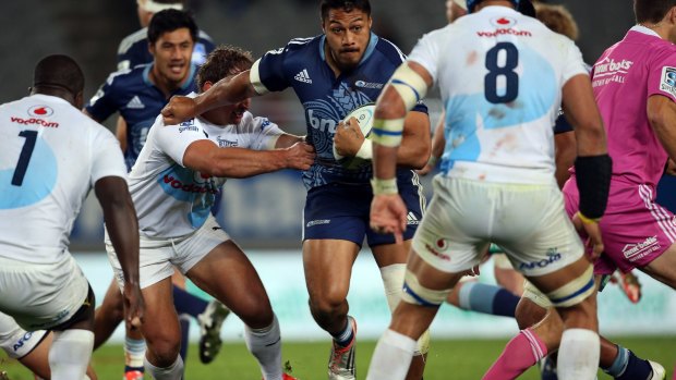 George Moala takes on the Bulls' defence.