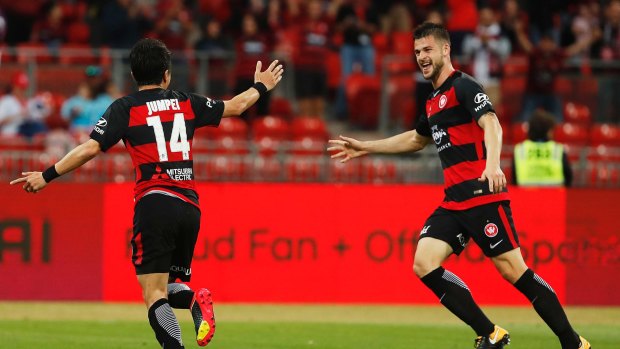 Business as usual: Jumpei Kusukami, left, scored the Wanderers' second goal.