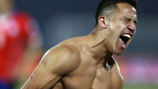 Chile's Alexis Sanchez celebrates after scoring the winning penalty.