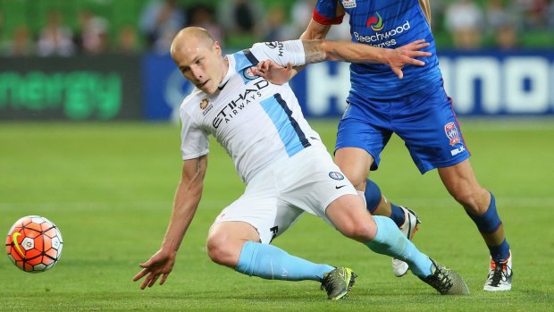Big names not translating into results: Melbourne City's Aaron Mooy slides in for the ball.