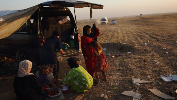 Residents of Mosul who fled their homes in June last year following Islamic State attacks.