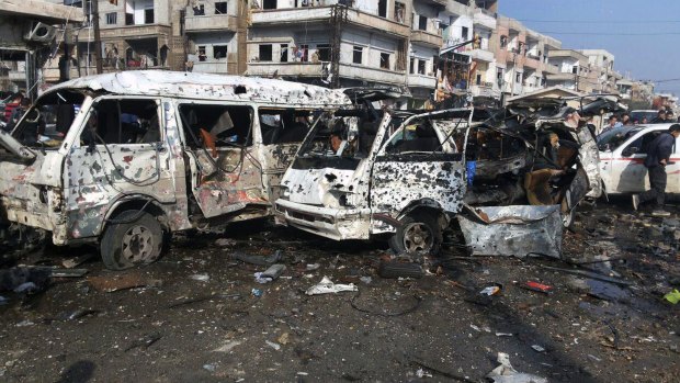 A photo, released by Syria's official news agency SANA on Sunday, reportedly shows the aftermath of two blasts in the pro-government neighbourhood of Zahraa in Homs. Reports said the blasts killed dozens of people and injured many others.