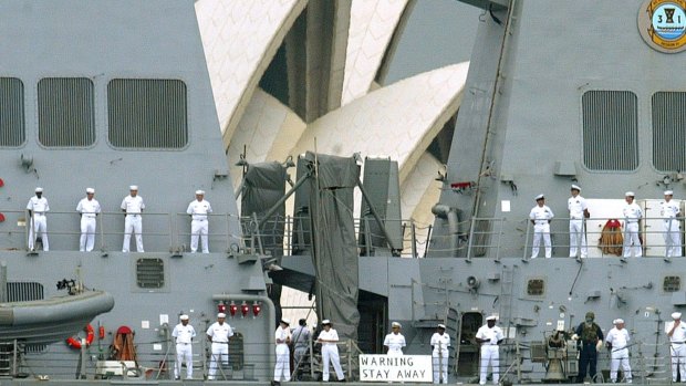 The Sydney Opera House can be seen behind the the USS Hopper during a 2004 visit to Australia.