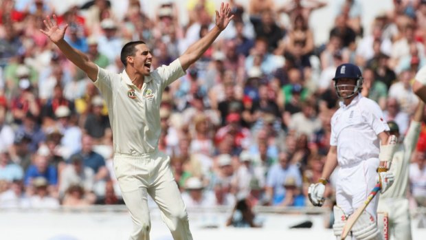 Johnson of Australia celebrates the wicket of Graeme Swann. 