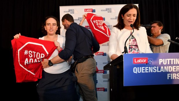 Adani protesters try to interrupt Queensland Premier Annastacia Palaszczuk on the first day of the recent state election campaign. 