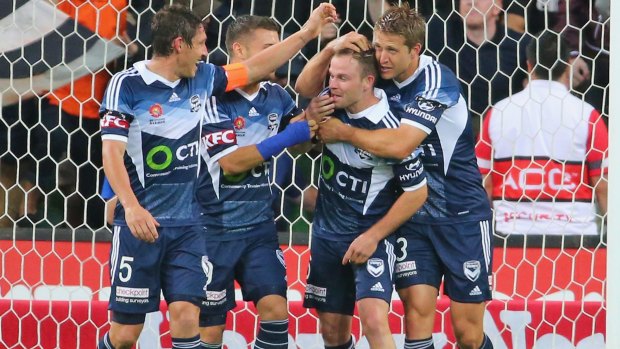 Team favourite: Leigh Broxham is congratulated by teammates after a goal against Adelaide United.