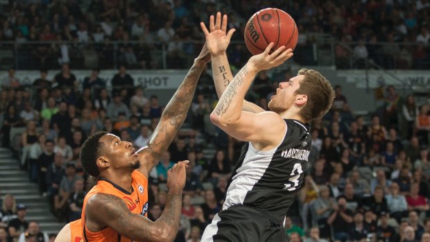 Aerial acrobatics: Melbourne United's Igor Hadziomerovic takes a flying shot at goal.