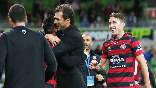 Smiling again: Wanderers coach Tony Popovic celebrates a goal by Frederico Piovaccari against  Melbourne City.