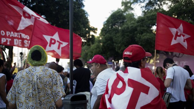 Demonstrators wave red flags in favour of Brazilian President Dilma Rousseff and the Workers' Party (PT) in Rio de Janeiro, Brazil.