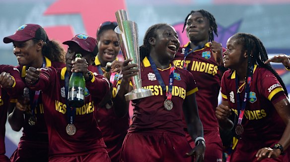 Celebration time: West Indies players with the World Twenty20 trophy after their upset final win over Australia.