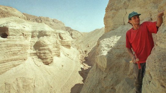 Roi Porat, an Israeli student of archaeology, works near the remains of a cave found at the West Bank archeological site of Qumran, near the Dead Sea in 2001. 