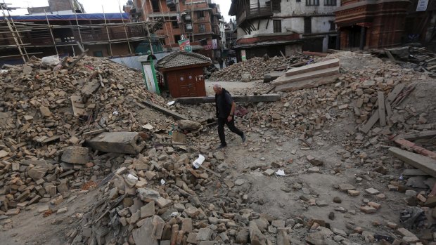 A man walks through the rubble of what was once a temple in Kathmandu on Sunday.