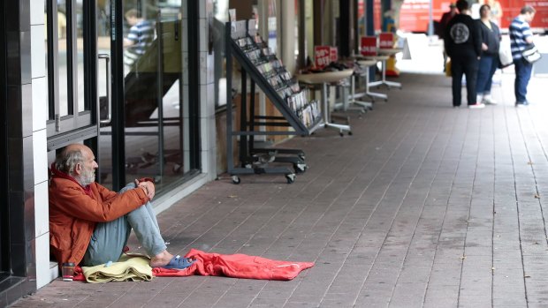 Seeking money in Garema Place: Canberra CBD has called on the government to deal with beggars and charity workers in the city.