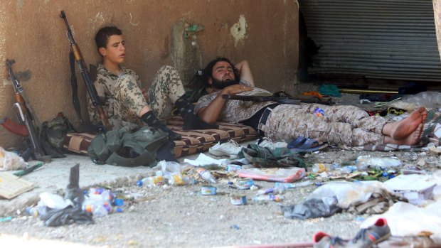 Fighters from a coalition of rebel groups called Jaish al-Fateh, also known as Army of Fatah, rest after clashes with forces loyal to Syria's President Bashar al-Assad in the Hama countryside.